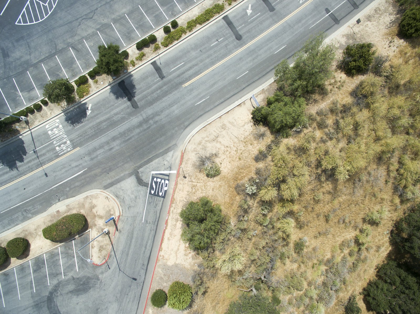 Aerial view of a paved road and lot